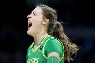 Sedona Prince of the Oregon Ducks screams before the start of the game against the Louisville Cardinals during the Sweet Sixteen round of the NCAA Women's Basketball Tournament at the Alamodome on March 28, 2021 in San Antonio, Texas.