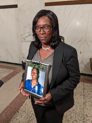 Martha Hollis with photo of Camisha Hollis