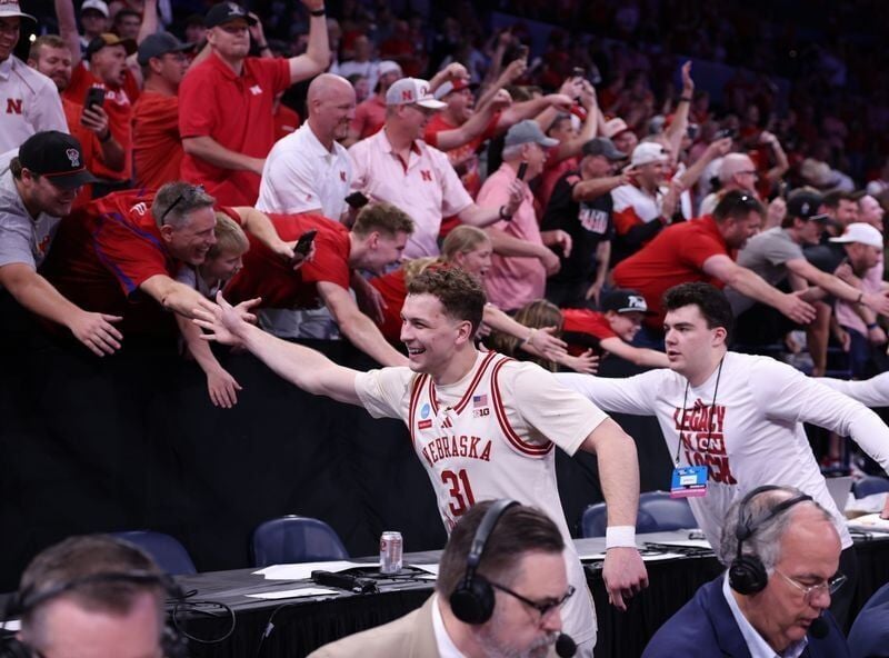Mar 21, 2026; Oklahoma City, OK, USA; Nebraska Cornhuskers guard Cale Jacobsen (31) celebrates with fans after defeating the Vanderbilt Commodores in a second round game of the men's 2026 NCAA Tournament at Paycom Center. Mandatory Credit: William Purne...