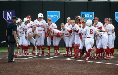 Nebraskaâ€™s Billie Andrews (6) is greeted by her teammates after hitting a homerum in the Big Ten softball tournament Friday, May 10, 2024 in Iowa City, Iowa.
