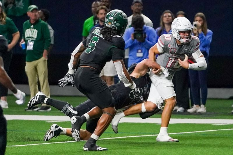 Dec 23, 2025; Frisco, TX, USA;  Ohio Bobcats linebacker Charlie Christopher (30) makes the tackle of UNLV Rebels quarterback Anthony Colandrea (10) during the second half at the Ford Center at The Star. Mandatory Credit: Raymond Carlin III-Imagn Images