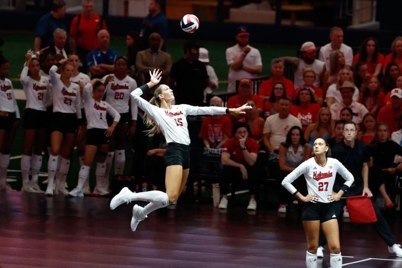 Aug 27, 2026; Arlington, TX, USA;  Nebraska Cornhuskers middle blocker Andi Jackson (15) serves the ball during their volleyball match against the Florida Gators at AT&T Stadium.  Mandatory Credit: Chris Jones-Imagn Images
