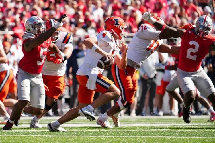 Illinois Fighting Illini quarterback Katin Houser (4) scrambles away from Ohio State Buckeyes linebacker Riley Pettijohn (5) during the NCAA football game at Ohio Stadium in Columbus on Sept. 26, 2026.