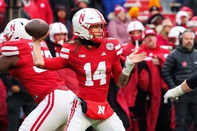 Nov 28, 2025; Lincoln, Nebraska, USA; Nebraska Cornhuskers quarterback TJ Lateef (14) passes against the Iowa Hawkeyes during the fourth quarter at Memorial Stadium. Mandatory Credit: Dylan Widger-Imagn Images