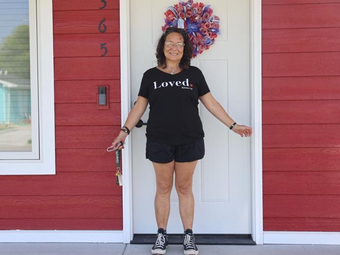 Bobbi Rocha on the porch of her home