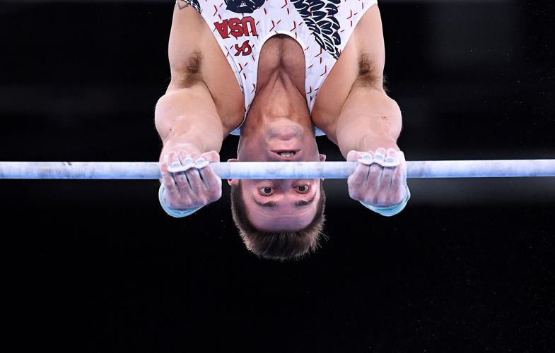 The United States' Samuel Mikulak competes on the high bar during Men's Team Gymnastics qualifying at the 2020 Tokyo Olympics on Saturday, July 24, 2021, in Tokyo.