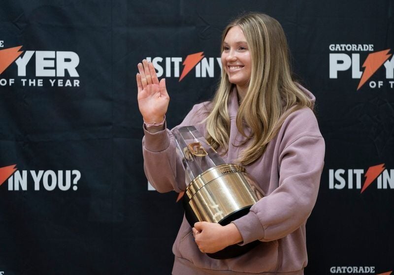Farmington Hills Mercy High Schoolâ€™s Campbell Flynn, 18, of Rochester Hills has some fun after she was presented with Gatorade Player of the Year for volleyball by surprise visitor, gold medal Olympic volleyball star April Ross on Friday, Jan. 10, 202...