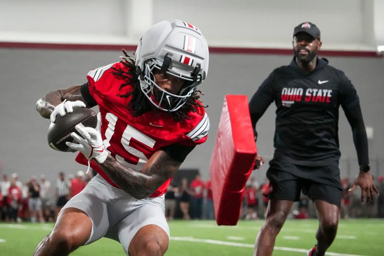 Ohio State Buckeyes wide receiver Chris Henry Jr. (15) catches a pass during football training camp inside the Woody Hayes Athletic Center in Columbus on Aug. 7, 2026.
