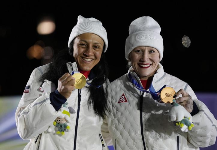 Elana Meyers Taylor of the United States and Kaillie Armbruster Humphries of the United States celebrate on the podium after the women's bobsleigh monobob competition during the Milano Cortina 2026 Olympic Winter Games at Cortina Sliding Centre on Feb 1...