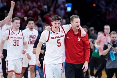 Nebraska coach Fred Hoiberg celebrates with Nebraska Cornhuskers forward Braden Frager (5) during a first-round game in the NCAA men's basketball tournament between Nebraska and Troy at Paycom Center in Oklahoma City, Thursday, March 19, 2026.