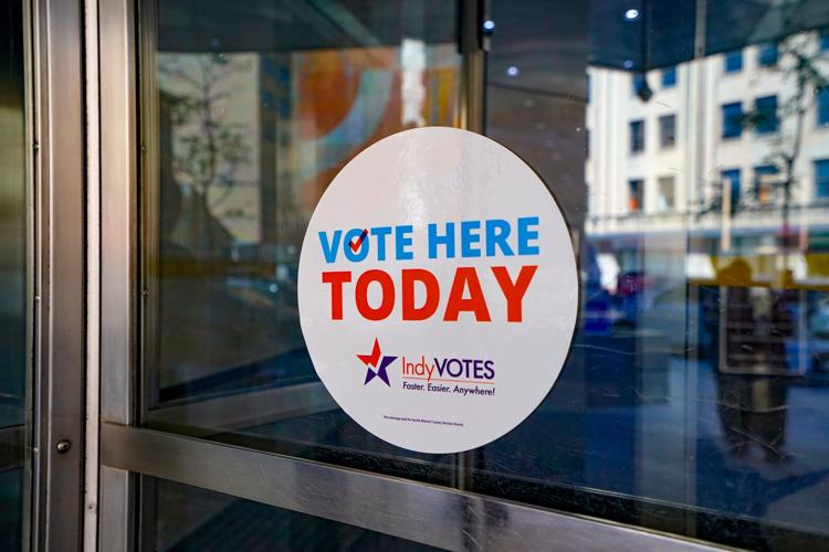 A “vote here today” sign welcomes voters to early voting at the City County Building on Tuesday, Oct. 6, 2026, in Indianapolis.
