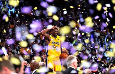 Kobe Bryant stands on the scorers' table at Staples Center after the Los Angeles Lakers defeated the Boston Celtics to win the NBA championship on June 17, 2010 at Staples Center.