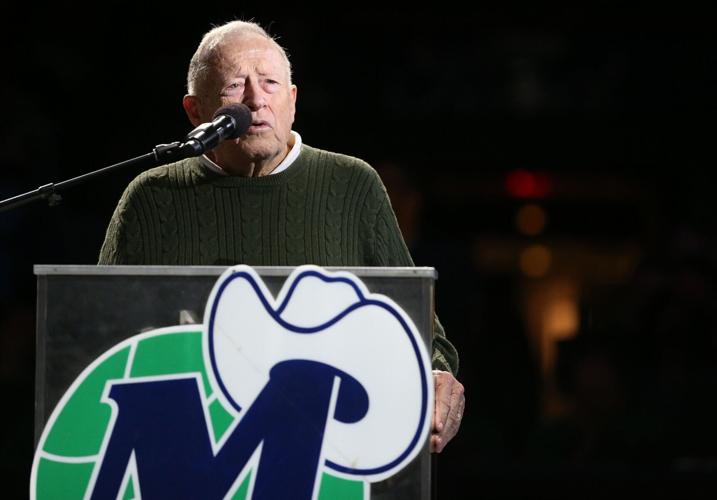 Former Dallas Mavericks head coach Dick Motta speakers during the jersey retirement ceremony for former Mavericks player Derek Harper during halftime of a National Basketball League game between the New York Knicks and Dallas Mavericks at the American A...