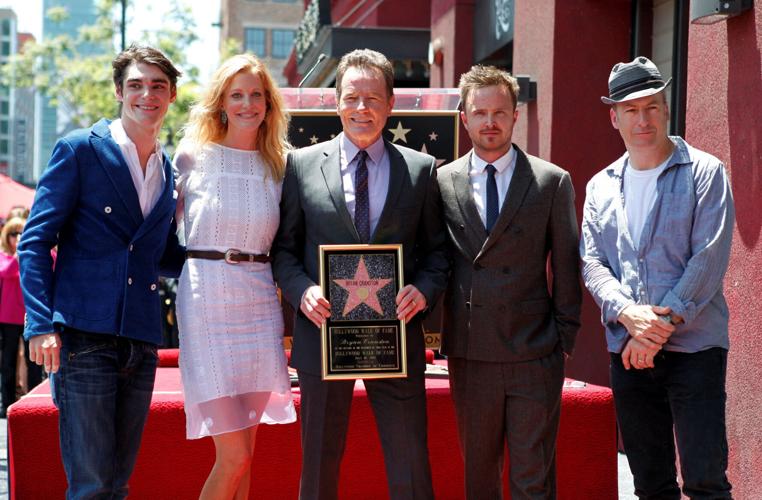 FILE PHOTO: Bryan Cranston and co-stars of "Breaking Bad" pose during ceremonies to unveil Cranston's star on the Hollywood Walk of Fame