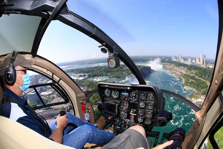 A view of Niagara Falls from the air, by boat and on foot