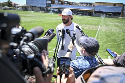 Offensive coordinator Davis Webb of the Denver Broncos speaks to members of the media during OTAs at the Broncos Park in Centennial, Colorado on Thursday, June 11, 2026.