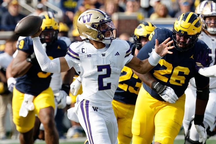 Oct 18, 2025; Ann Arbor, Michigan, USA;  Washington Huskies quarterback Demond Williams Jr. (2) passes in the first half against the Michigan Wolverines at Michigan Stadium. Mandatory Credit: Rick Osentoski-Imagn Images