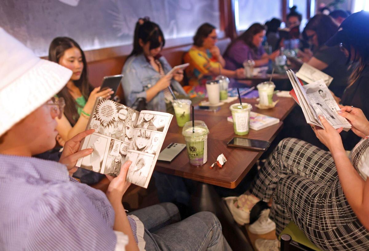 Members of the San Jose Silent Book Club take part in a reading session at a cafe on Sunday, July 26, 2026, in Campbell, Calif..