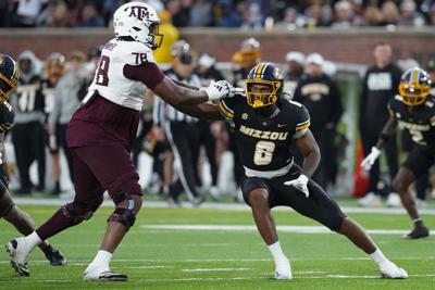Damon Wilson II of the Missouri Tigers rushes against Dametrious Crownover of the Texas A&M Aggies in the second half at Faurot Field at Memorial Stadium on Nov. 8, 2025, in Columbia, Missouri.