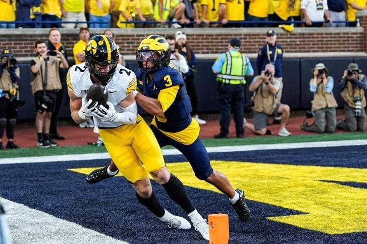 Iowa wide receiver Reece Vander Zee (2) makes a catch for a touchdown against Michigan cornerback Smith Snowden (3) during the second half at Michigan Stadium in Ann Arbor on Saturday, Sept. 26, 2026.