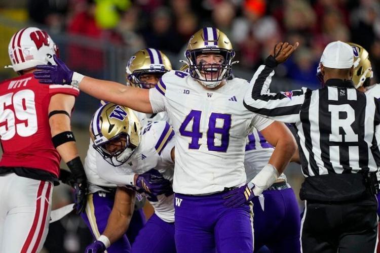 Nov 8, 2025; Madison, Wisconsin, USA;  Washington Huskies defensive end Jacob Lane (48) celebrates following a blocked punt during the second quarter against the Wisconsin Badgers at Camp Randall Stadium. Mandatory Credit: Jeff Hanisch-Imagn Images