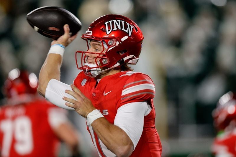 Nov 8, 2025; Fort Collins, Colorado, USA; UNLV Rebels quarterback Anthony Colandrea (10) attempts a pass in the second quarter against the Colorado State Rams at Sonny Lubick Field at Canvas Stadium. Mandatory Credit: Isaiah J. Downing-Imagn Images