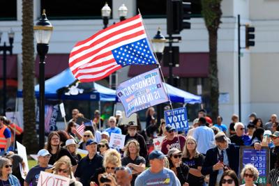 A flag is flown in distress at the Duval County Courthouse on Saturday, Oct. 17, 2026, in Jacksonville, Fla. Hundreds of local