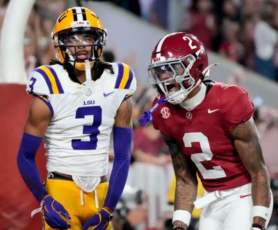 Nov 8, 2025; Tuscaloosa, Alabama, USA;  Alabama wide receiver Ryan Williams (2) celebrates his touchdown catch in front of LSU defensive back DJ Pickett (3) at Saban Field at Bryant-Denny Stadium. Mandatory Credit: Gary Cosby Jr.-Imagn Images