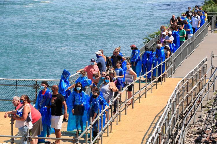 A view of Niagara Falls from the air, by boat and on foot