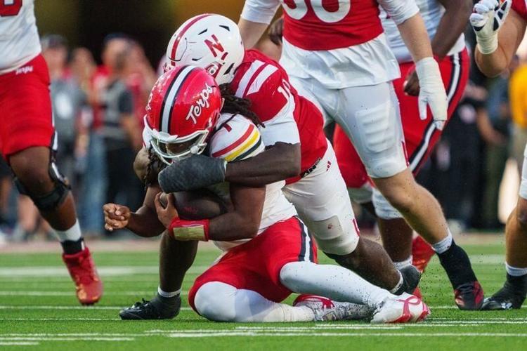 Oct 3, 2026; Lincoln, Nebraska, USA;  Maryland Terrapins quarterback Malik Washington (7) is sacked by Nebraska Cornhuskers linebacker Vincent Shavers Jr. (10) during the fourth quarter at Memorial Stadium.  Mandatory Credit: Dylan Widger-Imagn Images
