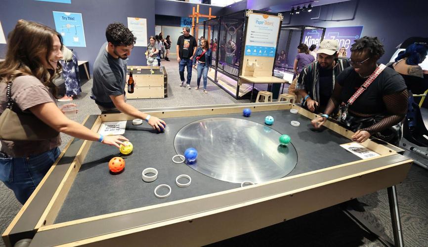 Guests play a game during Orlando Science Center’ s Science Night Live on Saturday, May 30, 2026.
