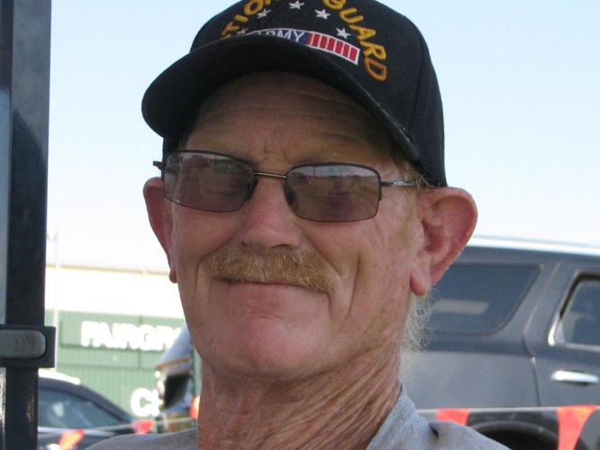 America 250 -- A veteran of the Army National Goard, Drew Runnells of Kearney was reminded of family members who served in the military as he waited for the entertainment to begin at Kearney's America 250 celebration to begin. .JPG