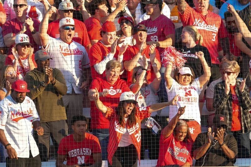 Nebraska fans celebrate after Nebraska's Hannah Camenzind (9) hits a home run during a NCAA super regional game between Tennessee and Nebraska at Sherri Parker Lee Stadium in Knoxville, Tenn., on May 23, 2025.
