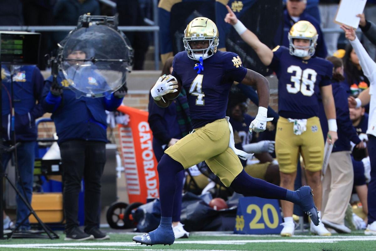 Jeremiyah Love #4 of the Notre Dame Fighting Irish runs the ball for a touchdown during the first quarter against the Syracuse Orange at Notre Dame Stadium on Nov. 22, 2025, in South Bend, Indiana.