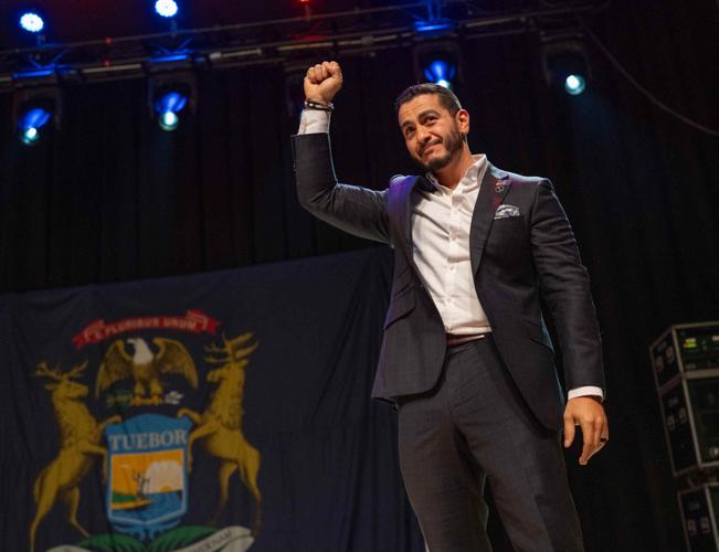 Abdul El-Sayed takes the stage to talk to supporters during his election night watch party at the Majestic Theatre in Detroit on