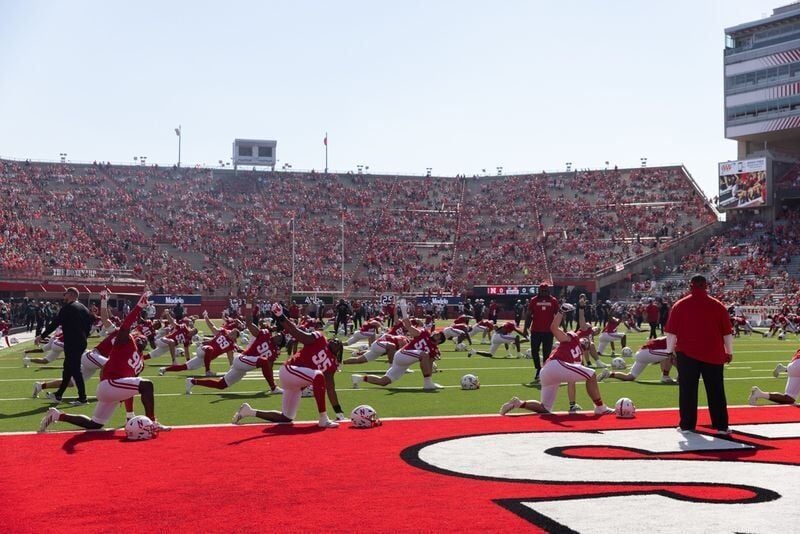 Oct 4, 2025; Lincoln, Nebraska, USA; Nebraska Cornhusker players stretch before the game against Michigan State at Memorial Stadium. Mandatory Credit: Kylie Graham-Imagn Images