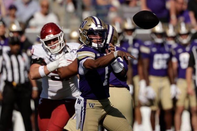 Sep 6, 2026; Seattle, Washington, USA;  Washington Huskies quarterback Demond Williams Jr. (1) throws a pass against the Washington State Cougars during the third quarter at Husky Stadium.  Mandatory Credit: Joe Nicholson-Imagn Images
