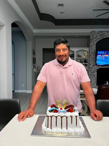 Lorenzo Salgado Araujo, a Mexican motorist who was fatally shot by an ICE agent during a vehicle stop in Houston, stands behind a birthday cake