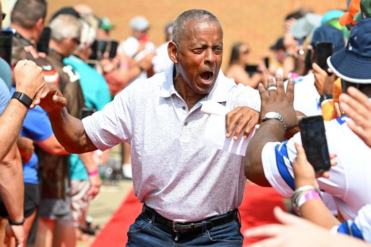 Hall of Fame running back Tony Dorsett celebrates with fans as he is introduced prior to the 2023 Pro Football Hall of Fame Enshrinement Ceremony at Tom Benson Hall Of Fame Stadium on Aug. 5, 2023, in Canton, Ohio.