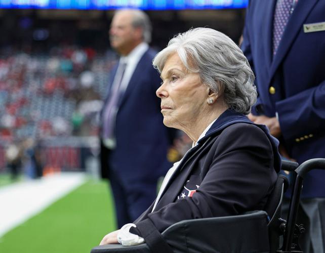 Houston Texans co-founder and former owner Janice McNair looks on with son and Texans chief executive officer Cal McNair in the background before a game against the Miami Dolphins at NRG Stadium in Houston on Dec. 15, 2024.
