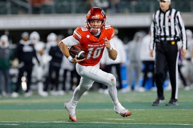 Nov 8, 2025; Fort Collins, Colorado, USA; UNLV Rebels quarterback Anthony Colandrea (10) scrambles and runs for a touchdown in the third quarter against the Colorado State Rams at Sonny Lubick Field at Canvas Stadium. Mandatory Credit: Isaiah J. Downing...