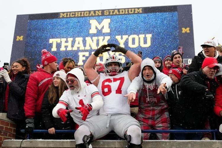 Ohio State tackle Austin Siereveld celebrates with fans after the win over Michigan on Nov. 29.