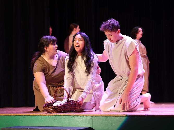 Moses' family putting him in the river