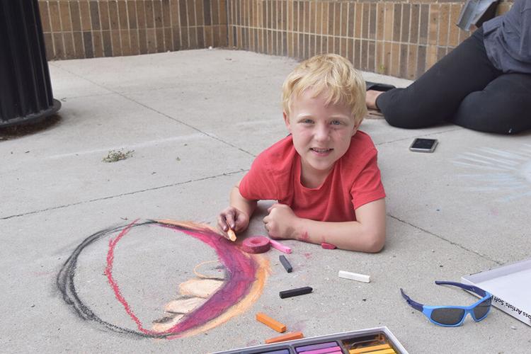 As Chalkfest nears, youth beautify Heritage Square Plaza Local News