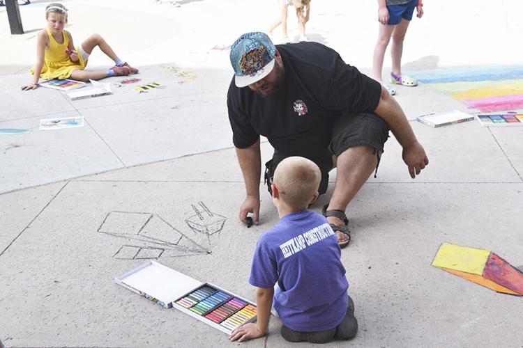 As Chalkfest nears, youth beautify Heritage Square Plaza Local News