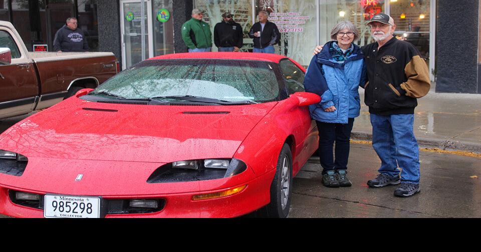 Cars rev through the rain in Wahpeton Car Show