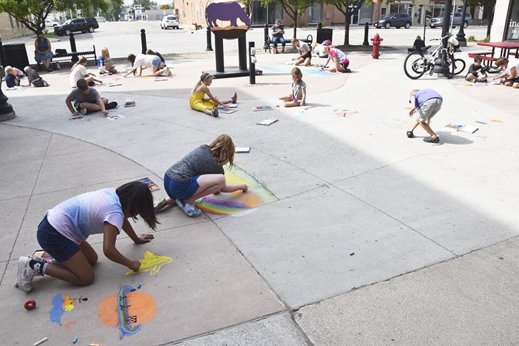 As Chalkfest nears, youth beautify Heritage Square Plaza Local News