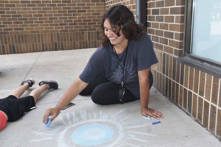 As Chalkfest nears, youth beautify Heritage Square Plaza Local News