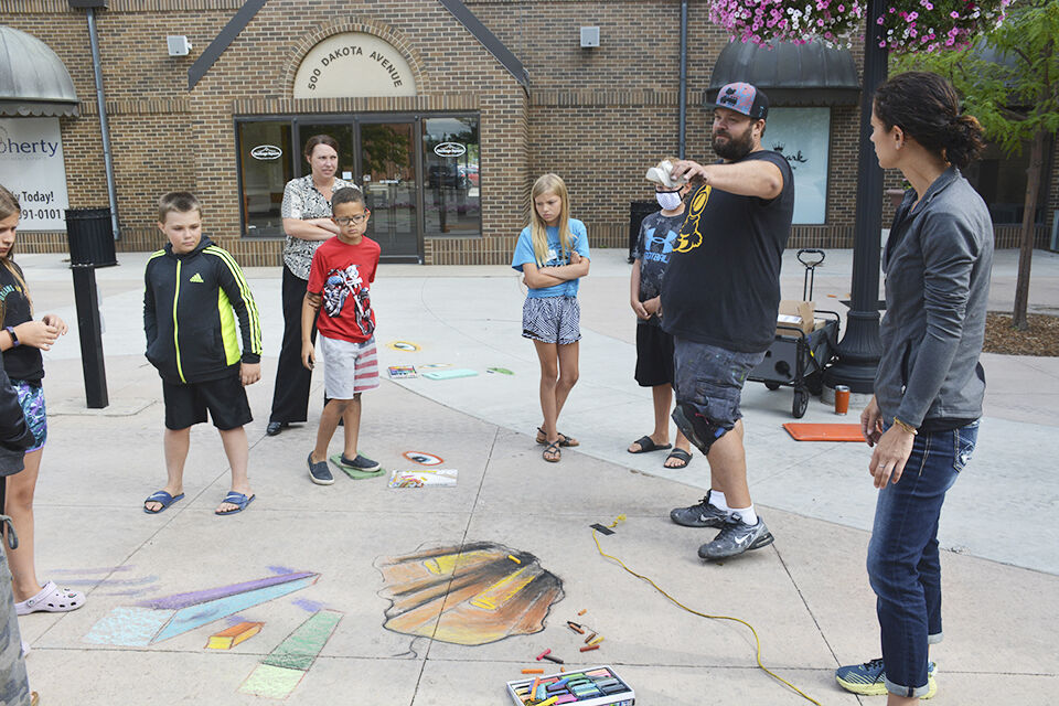 Youth take preChalkfest outdoor art class Local News Stories
