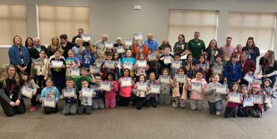 WHA second-graders and staff celebrated their accomplishments with a trip to the WACC to meet with Walker Rotary Club members.